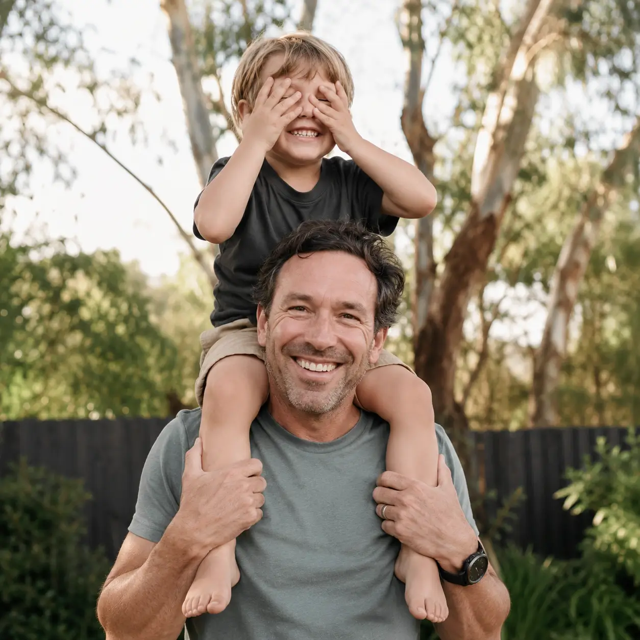 Australian father with his son on his shoulders